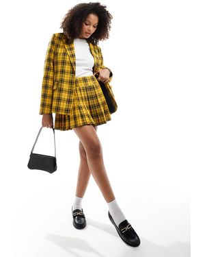 Something New Iconic clueless - mini-jupe d'ensemble plissée à carreaux - Jaune