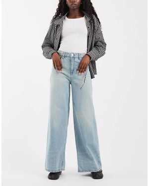ASOS Jean baggy à jambe large délavé clair - Bleu