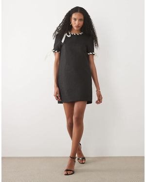 Sister Jane Camille jacquard-minikleid mit kurzen ärmeln und bandbesatz - Schwarz