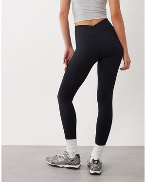 4505 Leggings Deportivos Negros De Talle Alto Sin Costuras Con Detalle Cruzado En La Parte Trasera De Canalé Fino De - Azul