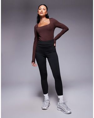 ASOS – figurformende leggings mit - Blau