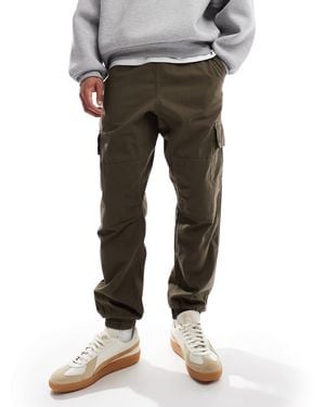 New Look Pantalon cargo ajusté avec chevilles resserrées - kaki foncé - Gris