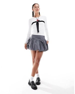 Glamorous Mid Rise Puff Ball Mini Skirt With Bow Detail - Blue