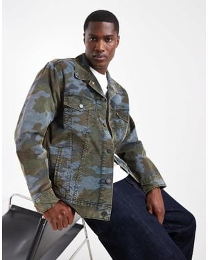 Levi's Lockere jeans-truckerjacke mit military-muster - Blau