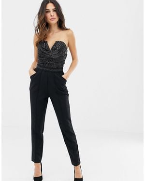 Lipsy Tuta jumpsuit a fascia nera con paillettes - Nero