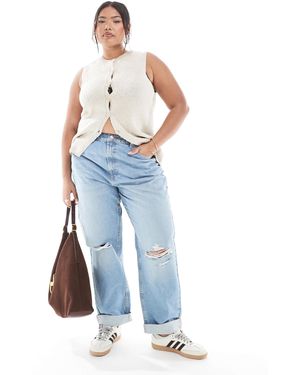ASOS Asos design curve - jean mom décontracté à taille haute avec déchirures aux genoux - clair délavé - Bleu