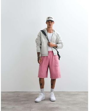 Nike Pantalones Cortos De Punto Con Logo Y Bolsillo Trasero En Rosa Palo - Blanco