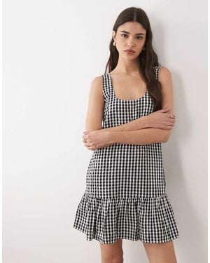 Nobody's Child Millie Sleeveless Dropped Waist Ruffle Hem Cotton Mini Dress - Black