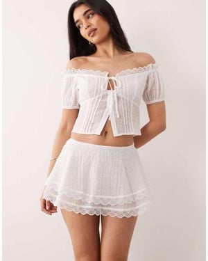 The Frolic Exclusive Lace Trim Tiered Mini Frilly Skirt - White