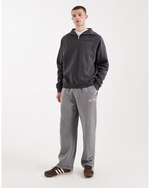 Hollister Cuffed baggy joggers With Logo Graphic - Blue