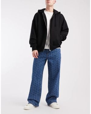 Tommy Hilfiger Theo baggy Jeans With All Over Print - Blue