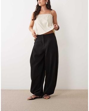 ASOS Getailleerde Toelopende Broek Met Drukknopen Aan De Zoom - Zwart