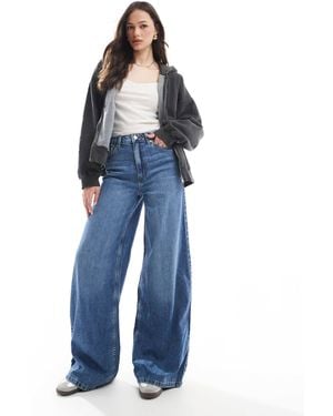 ASOS Asos design tall - jean ample - moyen délavé - Bleu