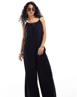 esmé studios Tuta Jumpsuit Ampia Da Mare Nera Trasparente Scollata Sul Retro Con Allacciatura Frontale - Blu