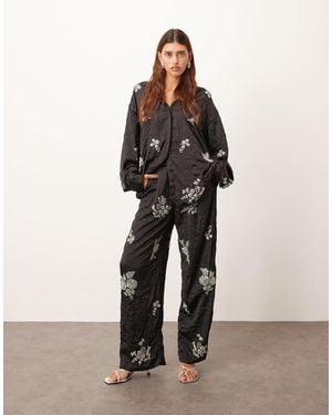 ARRANGE Crinkle Satin Floral Embellished Pants - Black