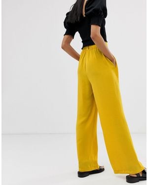 Pantalon amarillo stradivarius new arrivals