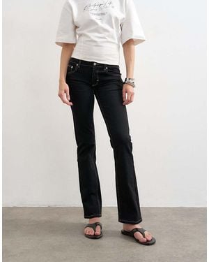 TOPSHOP Vaqueros Negros De Talle Bajo Y Pernera Slim De