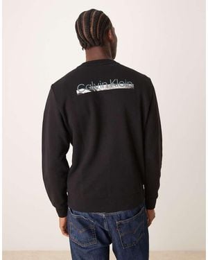 Calvin Klein Sudadera Negra Con Estampado Gráfico En La Espalda De -Negro