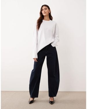 ARRANGE Tova Tapered Curved Leg Jeans With Roll Hem - White