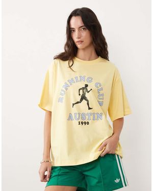 ASOS Short Sleeve Oversized T-shirt With Running Club Graphic - Yellow