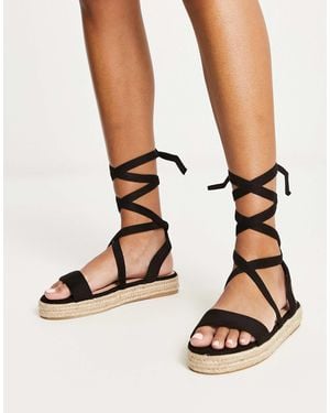 Truffle Collection Sandales style espadrilles avec liens à nouer à la cheville - Noir
