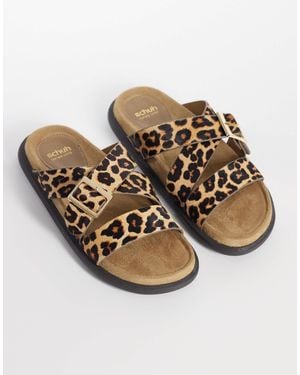 schuh – tear – flache sandalen mit ponyfell-struktur, überkreuztem design und schnalle - Natur
