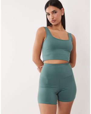 4505 Hourglass Icon Active High Waist 5 Inch Legging Short With Zip Phone Pocket - Green