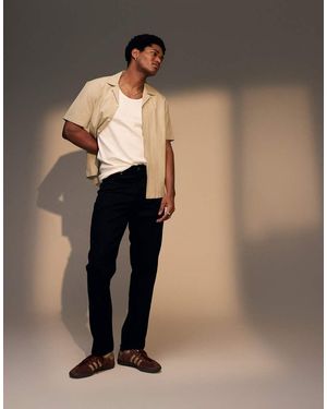 TOPMAN Vaqueros Negros Rígidos De Corte Tapered De