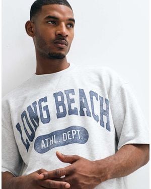 Hollister T-Shirt Oversize Chiaro Con Grafica Sul Davanti - Bianco
