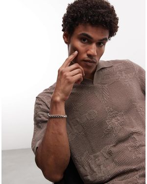 ASOS Polo oversize en maille texturée avec détails fleuris et col cranté - Marron
