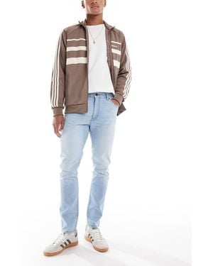 Wrangler Vaqueros Azules De Corte Tapered Slim Con Lavado Claro Larston De