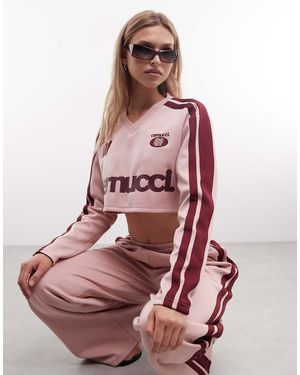 CERNUCCI Cropped Voetbaltop Met Lange Mouwen, V-Hals, Logo En Bies Op De Mouw - Roze