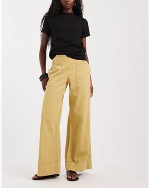 Free People Breezy Low Rise Flare Pull On Trouser - Yellow