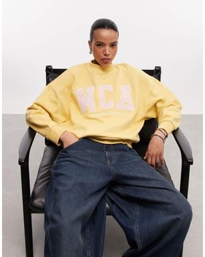 ASOS Weekend collective - sweat oversize à logo universitaire rose - Bleu
