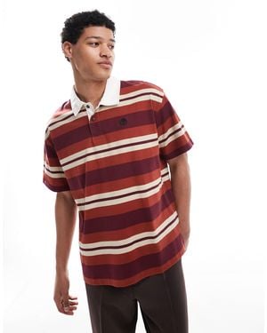 Timberland – gestreiftes polohemd im rugby-stil - Rot