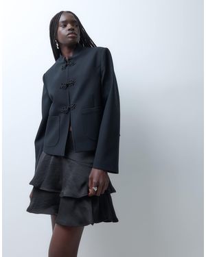 Vero Moda Jupe courte à étages avec détail à la taille e - Bleu