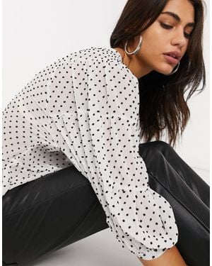 Stradivarius Blusa blanca con peplum y lunares - Blanco