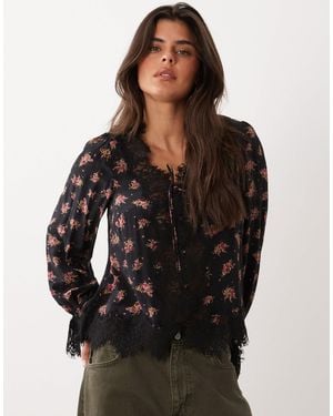 Nobody's Child Wilde bluse mit v-ausschnitt, spitzenbesatz und bindeband-detail - Schwarz
