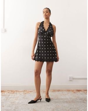 Lioness Stars align - robe courte dos nu à pois avec bords en dentelle - noir et crème - Neutre