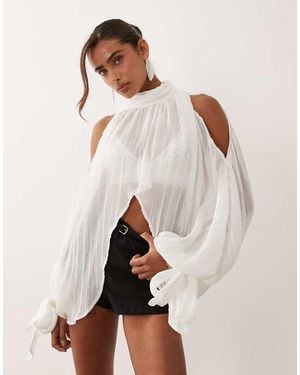Noughts & Kisses Plisse High Neck Wide Cape Sleeve Tie Detail Cropped Blouse - Natural