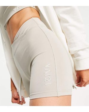 VAI21 Leggings Cortos Color Topo Con Detalle Cruzado De -Beis Neutro