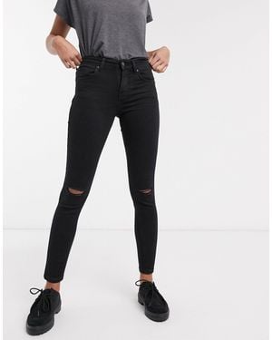 Bershka Vaqueros ajustados push up en negro con roto en la rodilla