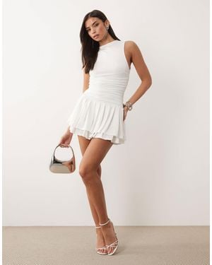 Aria Cove Slinky High Neck Sleeveless Ruched Waist Ruffle Skirt Mini Dress - Natural