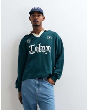 ASOS Polo Oversize Con Colletto A Contrasto, Stampa Pigmentata E Fondo Asimmetrico - Blu