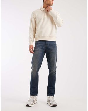 ASOS Vaqueros Elásticos De Corte Slim Con Lavado Azul Medio Y Lavado Vintage De