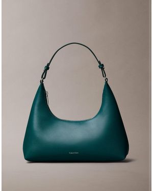 Calvin Klein Sac porté épaule à logo métallisé - Vert