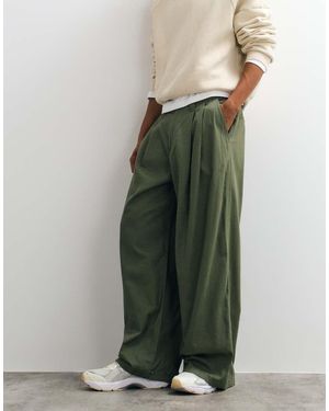 Weekday Pantaloni Chino Oversize Color Kaki - Verde