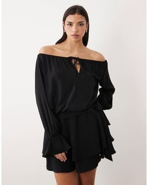Gina Tricot – schulterfreies, langärmliges minikleid - Schwarz