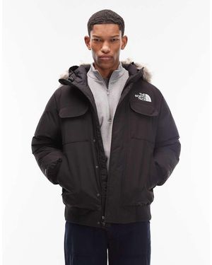 The North Face Chaqueta Bomber Negra Acolchada Con Capucha Y Ribete De Piel Sintética Mcmurdo De -Negro