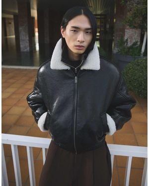 Bershka Veste effet vinyle à col en fausse fourrure - Noir